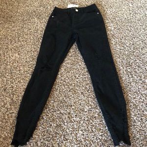 Black distressed skinny jeans